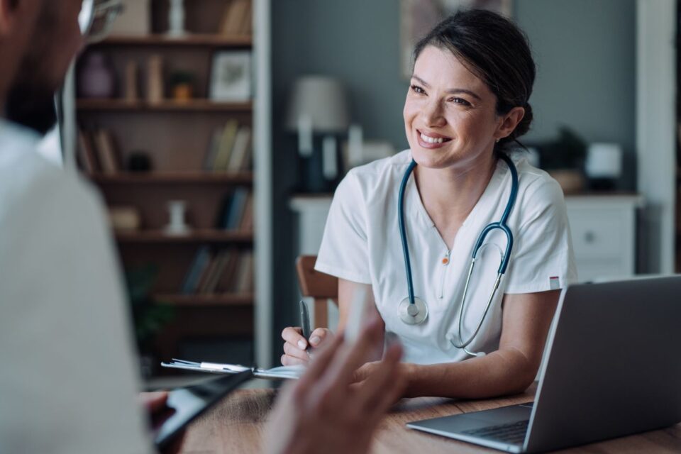 Smiling nurse consulting with a patient in Jackson, MS