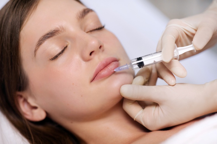 Close-up of cosmetic filler injection into the upper lip in Jackson, MS
